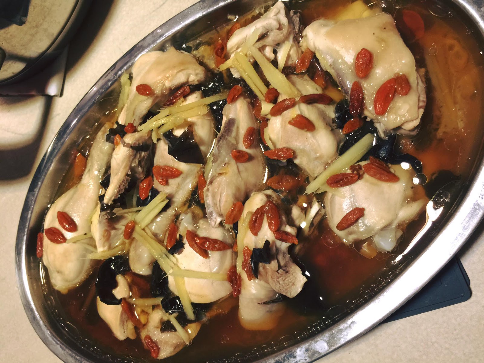Steamed chicken thighs with chicken essence by Yenn Theng Teo