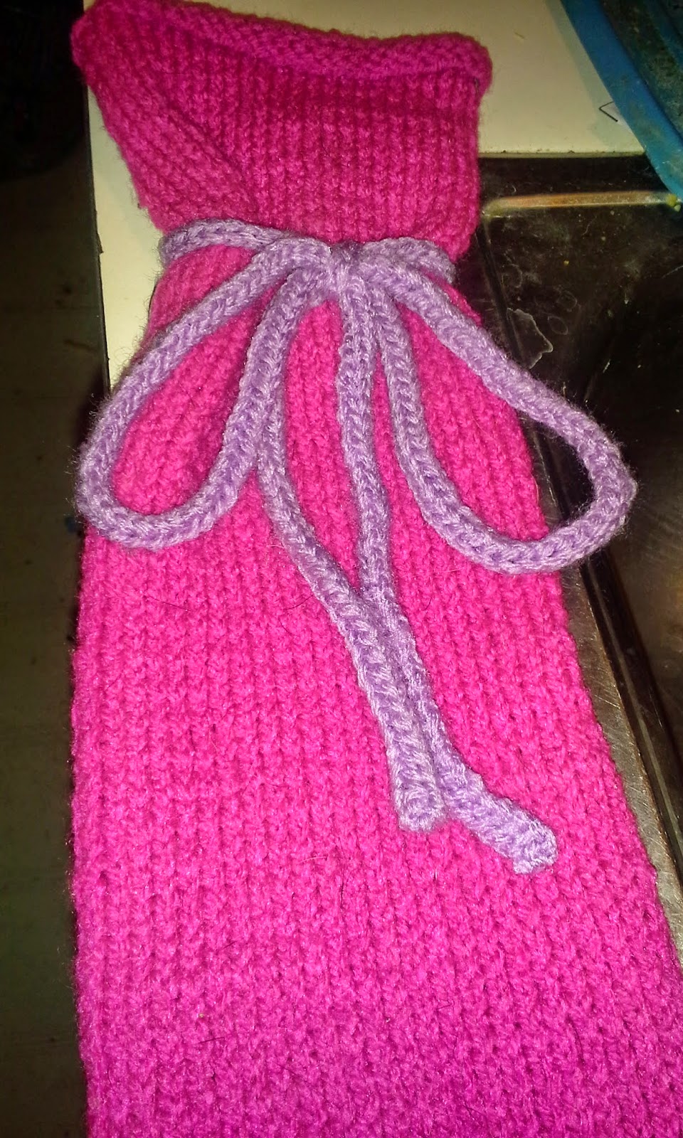 knitted plastic bag holder.