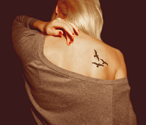 Small Bird Tattoo On Back