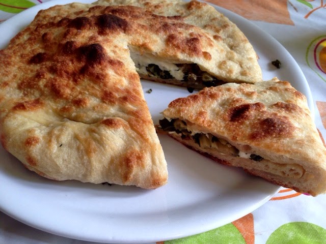 Stuffed pizza with sausages, Swiss chard, and mozzarealla.