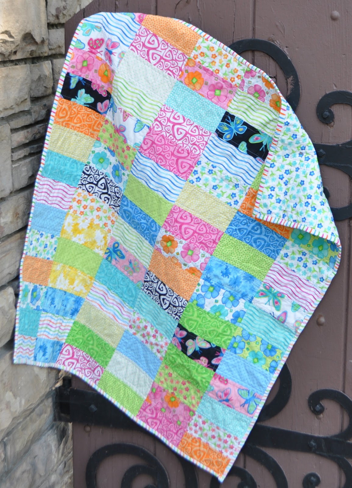 Richard and Tanya Quilts Twirl Brick Baby Quilt
