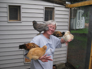Woman with chickens perched on her arms and shoulders in Pittsburgh