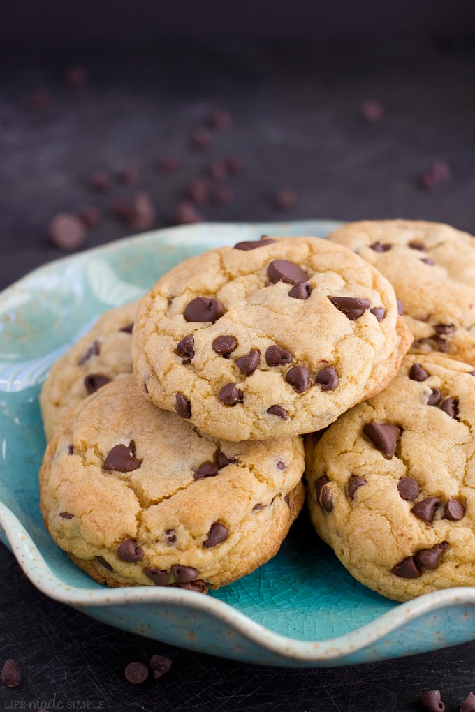 Softbatch Chocolate Chip Cookies stacked on a blue plate