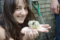 Carrie holds a fuzzy yellow chick