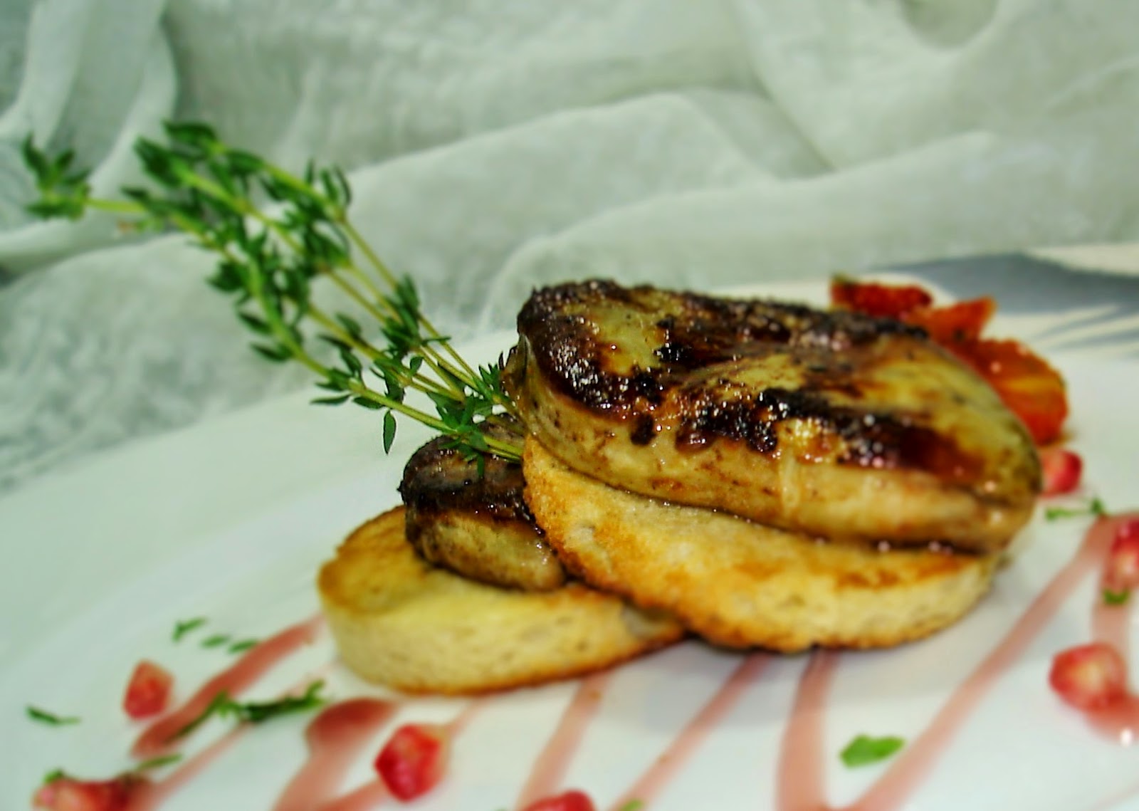 Chef Giuseppe Mosti Pan Seared Goose Liver with Cadied Tomatoes and Pomegranate Coulis