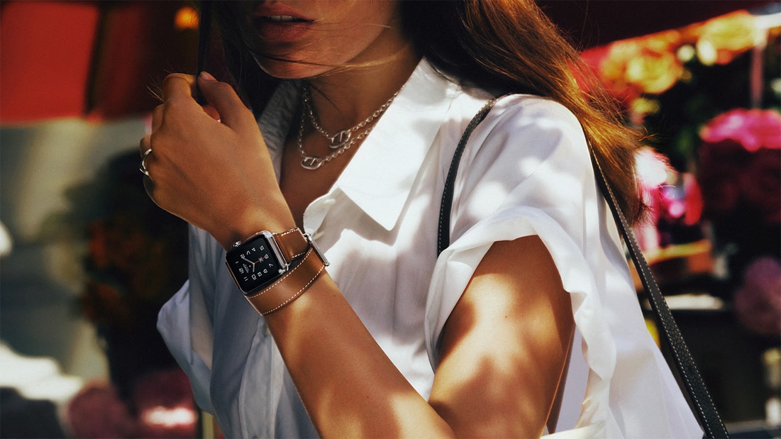 Model wearing the Apple Watch Hermès Double Tour in Brown Fauve | Source: Apple