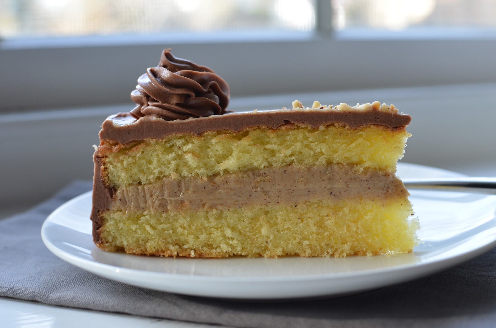 Playing with Flour Hazelnut cake with praline and milk chocolate