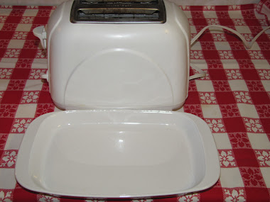 This dish serves as a crumb catcher under the toaster.