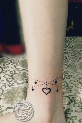 anklet tattoo with heart pendants