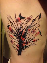 Flying birds from tree tattoo on side body