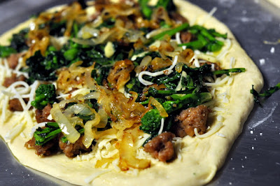 White Pizza with Spicy Italian Sausage, Broccoli Rabe, and Caramelized Onions | Taste As You Go