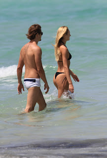 Candice Swanepoel in a Black thong Bikini at Miami beach