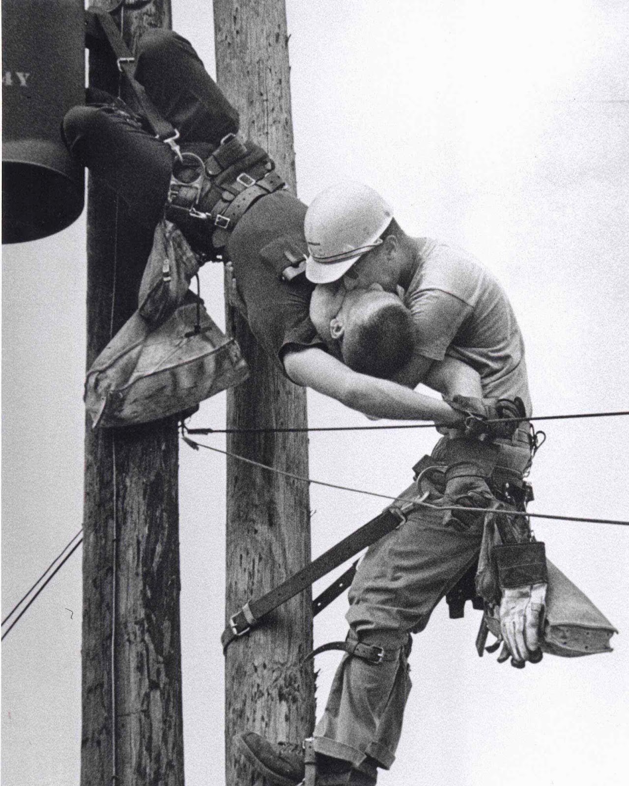 The+Kiss+of+Life+-+A+utility+worker+giving+mouth-to-mouth+to+co-worker+after+he+contacted+a+high+voltage+wire,+1967.jpg