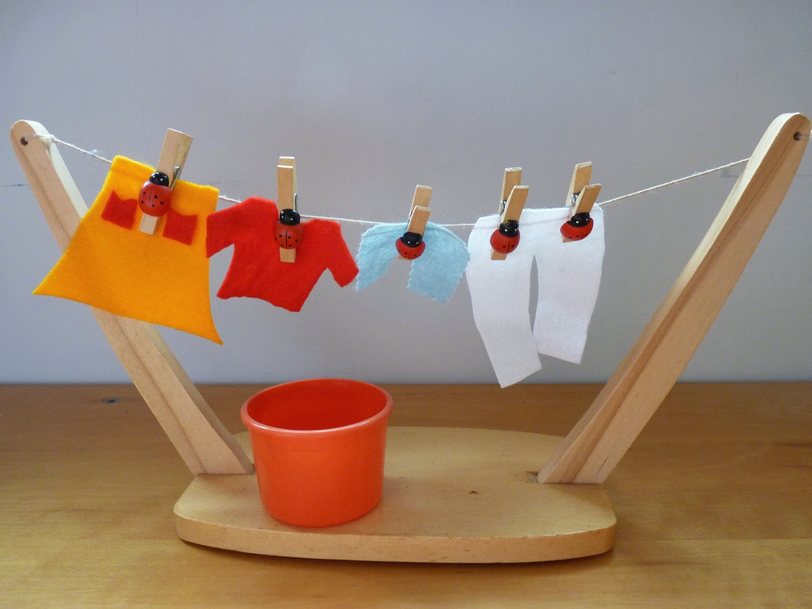 Practical Life IX Using clothespins (clothespegs)