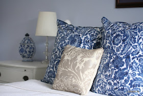 white linen and furniture with blue and white accents in cushions