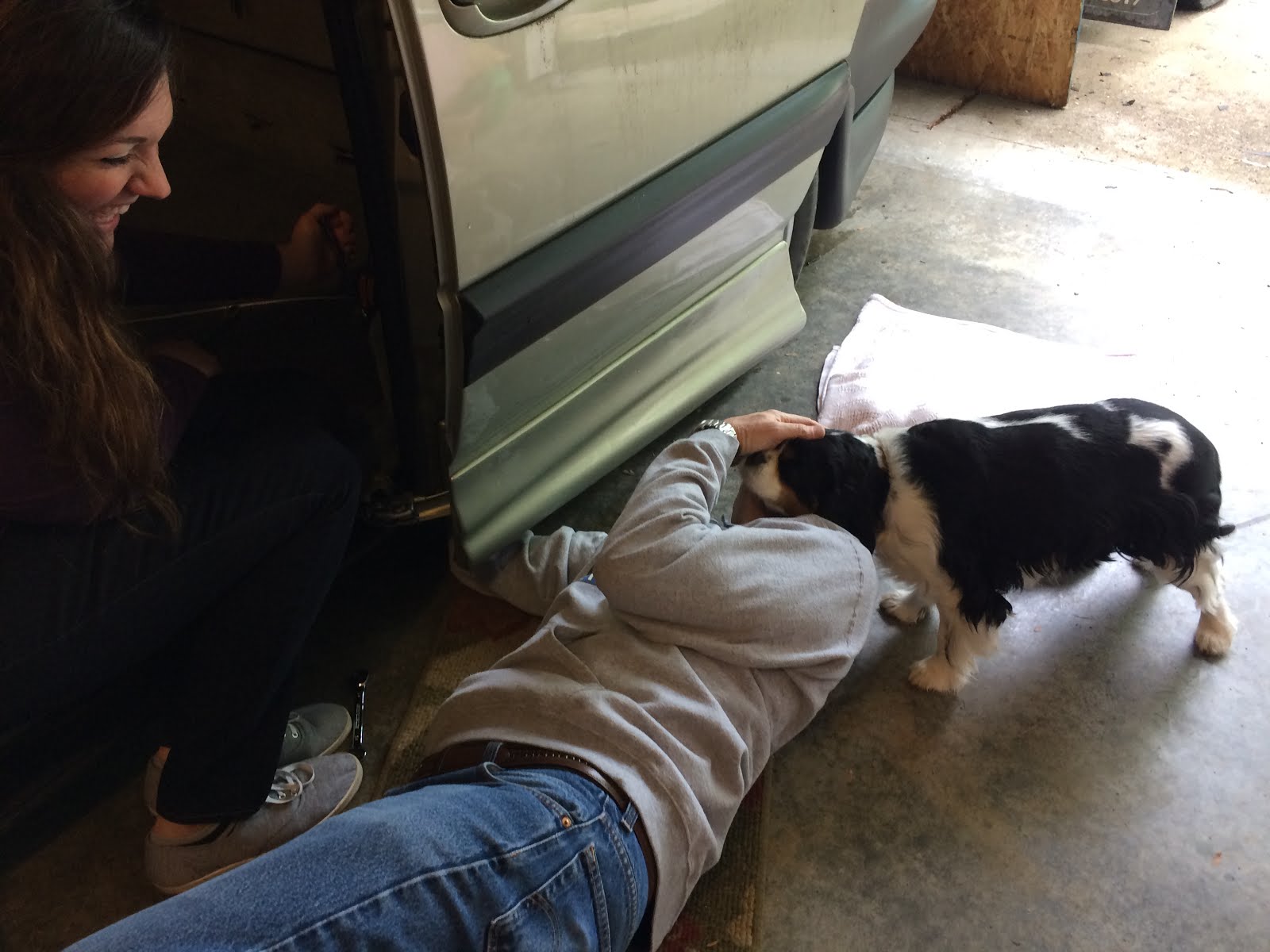 Sam Slayden installing winch in van with help from Charlie