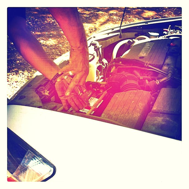 DIY wire hanger car battery holder