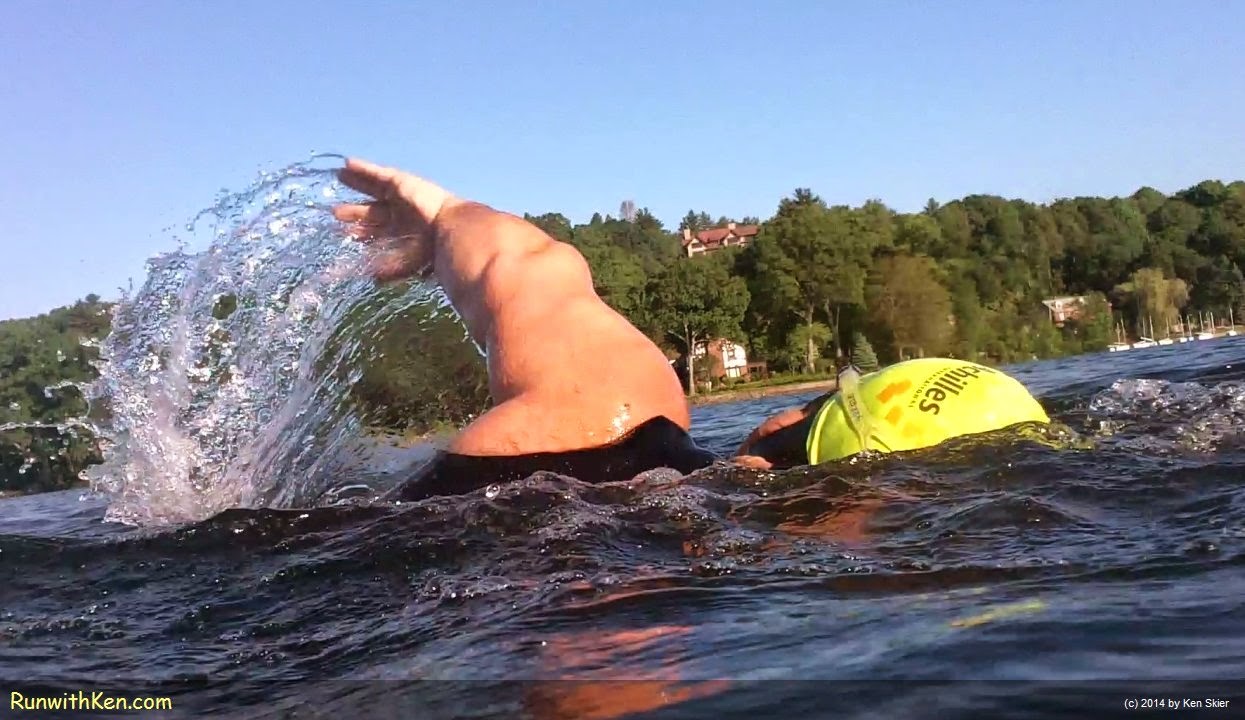 Dramatic up-close photo of a open water swimming at a New England lake