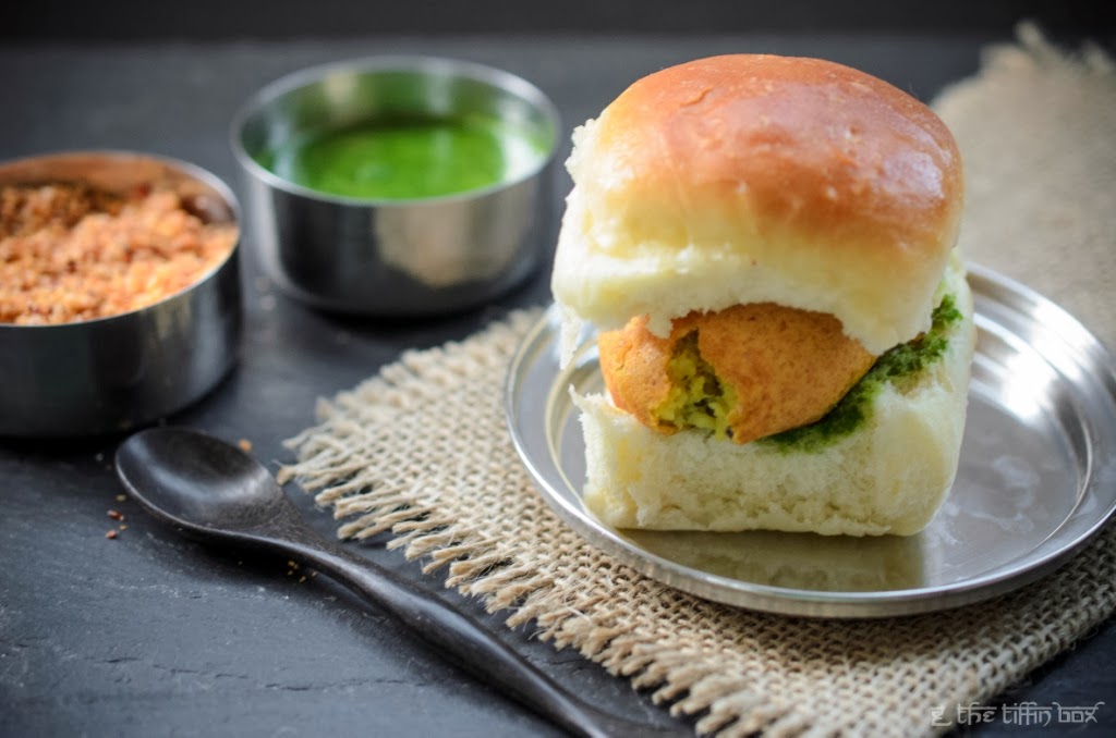 indian street food - vada pav (spicy potato patties in a soft roll) with dry garlic/ chilli/ coconut and cilantro/ mint chutneys 