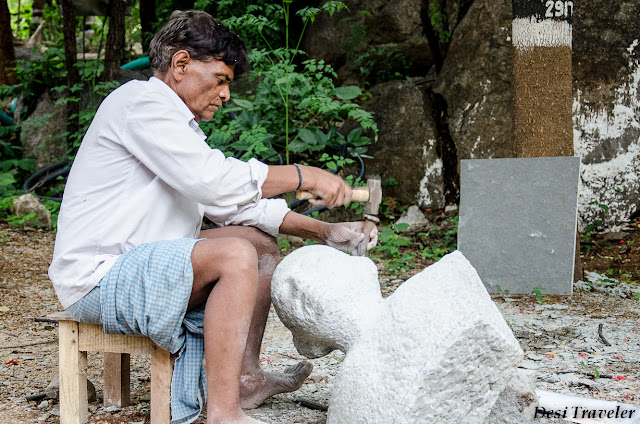 man making stone idols at shilparamam