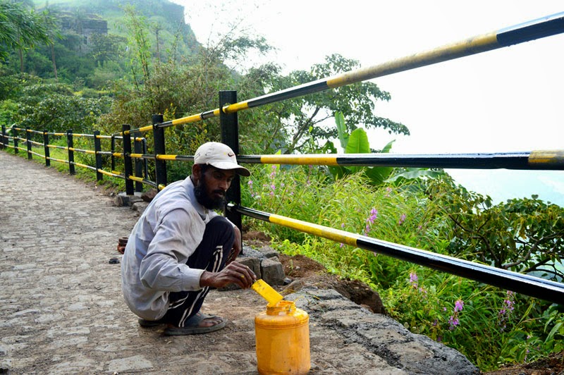 painter painting Pipes at Sinhagad Fort Painting pipe