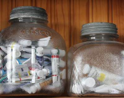 glass jars with paint tubes