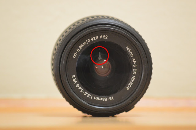 18-55mm NIKKOR lens with scratch on it