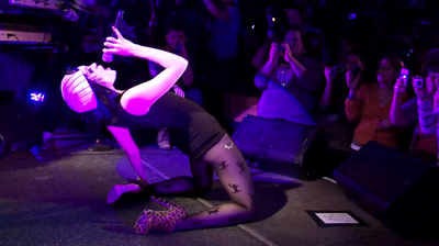 Jessie J, singing on her knees, performing live in New York, 2010.