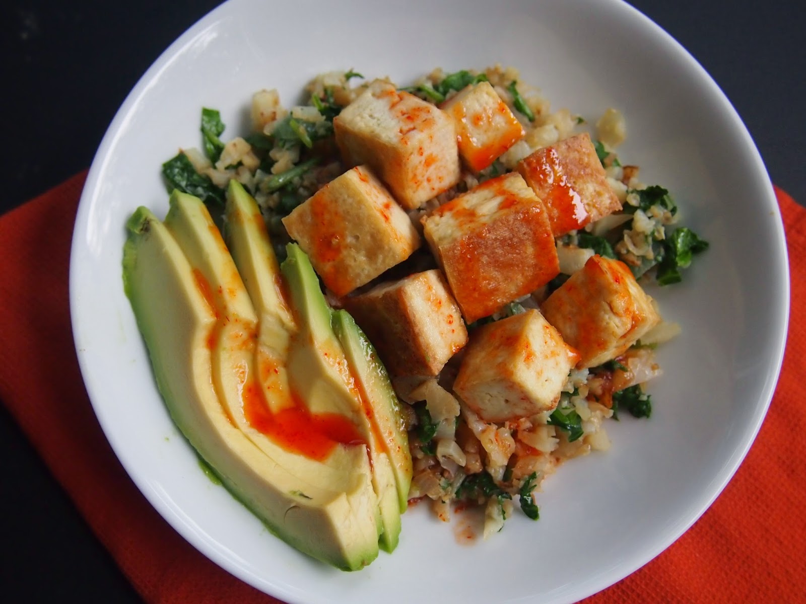 An Avocado A Day Cauliflower Rice and Tofu Bowl with SrirachaLime Sauce