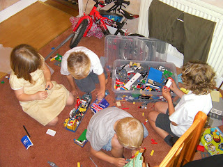 schoolchildren with giant lego collection lego electric train track and buildings