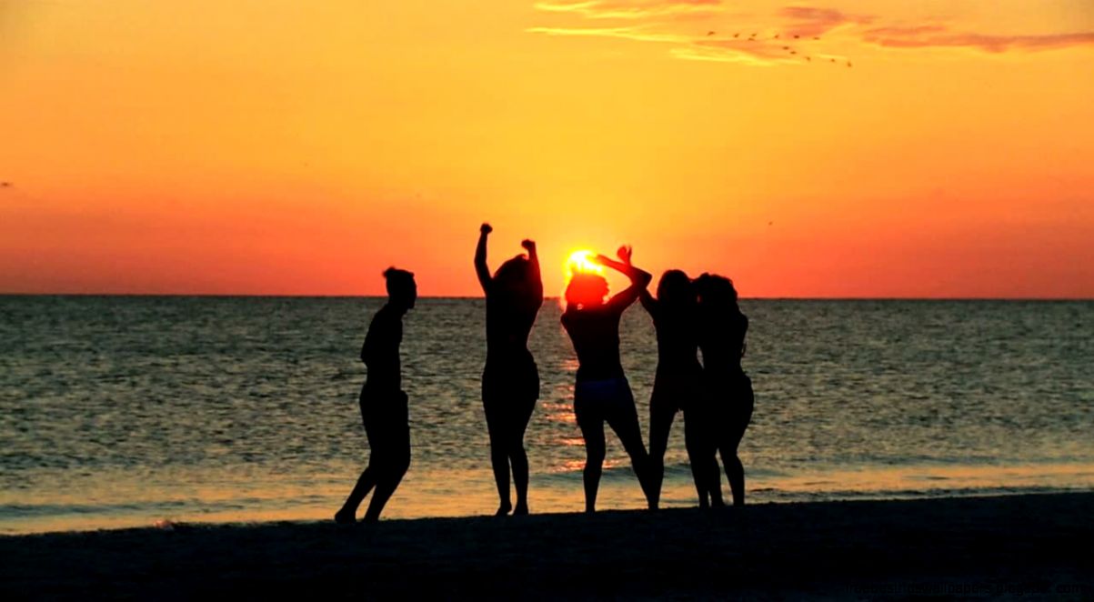stock footage young people in silhouette enjoying time together stock footage young people in silhouette enjoying time together