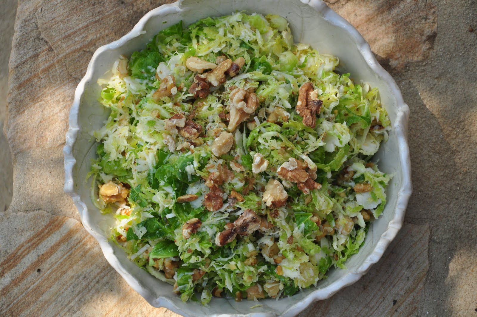 Bite Me Raw Brussels Sprouts Salad with Manchego and Toasted Walnuts