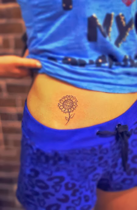 sunflower tattoo on the hip