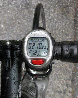 Raindops on bike computer, 2,320 ft. of ascent; 2 hours, 10 minutes, 23 seconds of time; heart rate 121 bpm.
