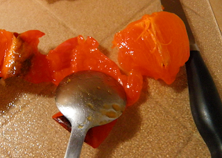 Spoon Scraping Fruit from Skin