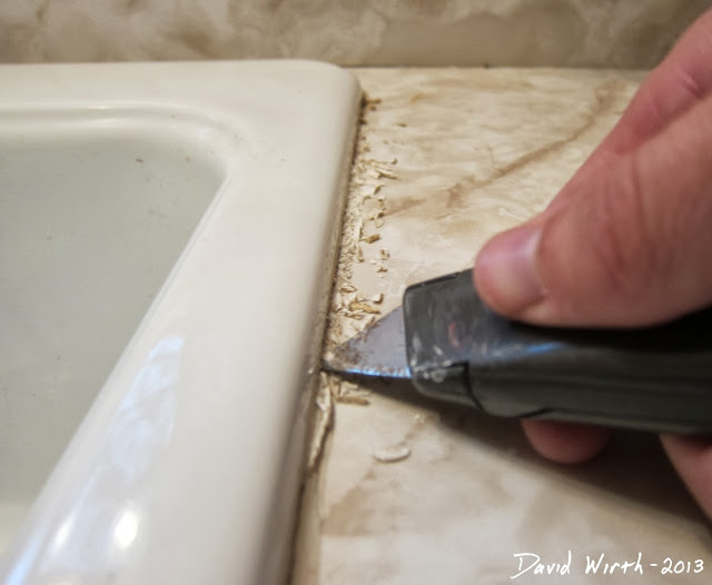 how to remove cracked caulk, sink, razor blade, utility knife