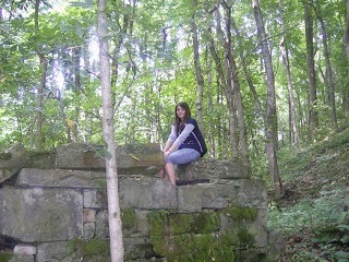 A teen girl who is resting in the middle of the forest to conserve energy. A teen girl who is resting in the middle of the forest to conserve energy.