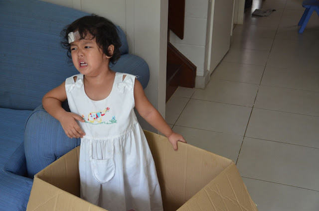 Kecil crying, standing in the Box