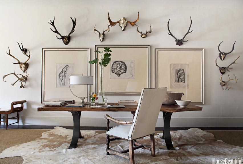 Cowhides Layered Over Natural Fiber Rugs Driven by Decor
