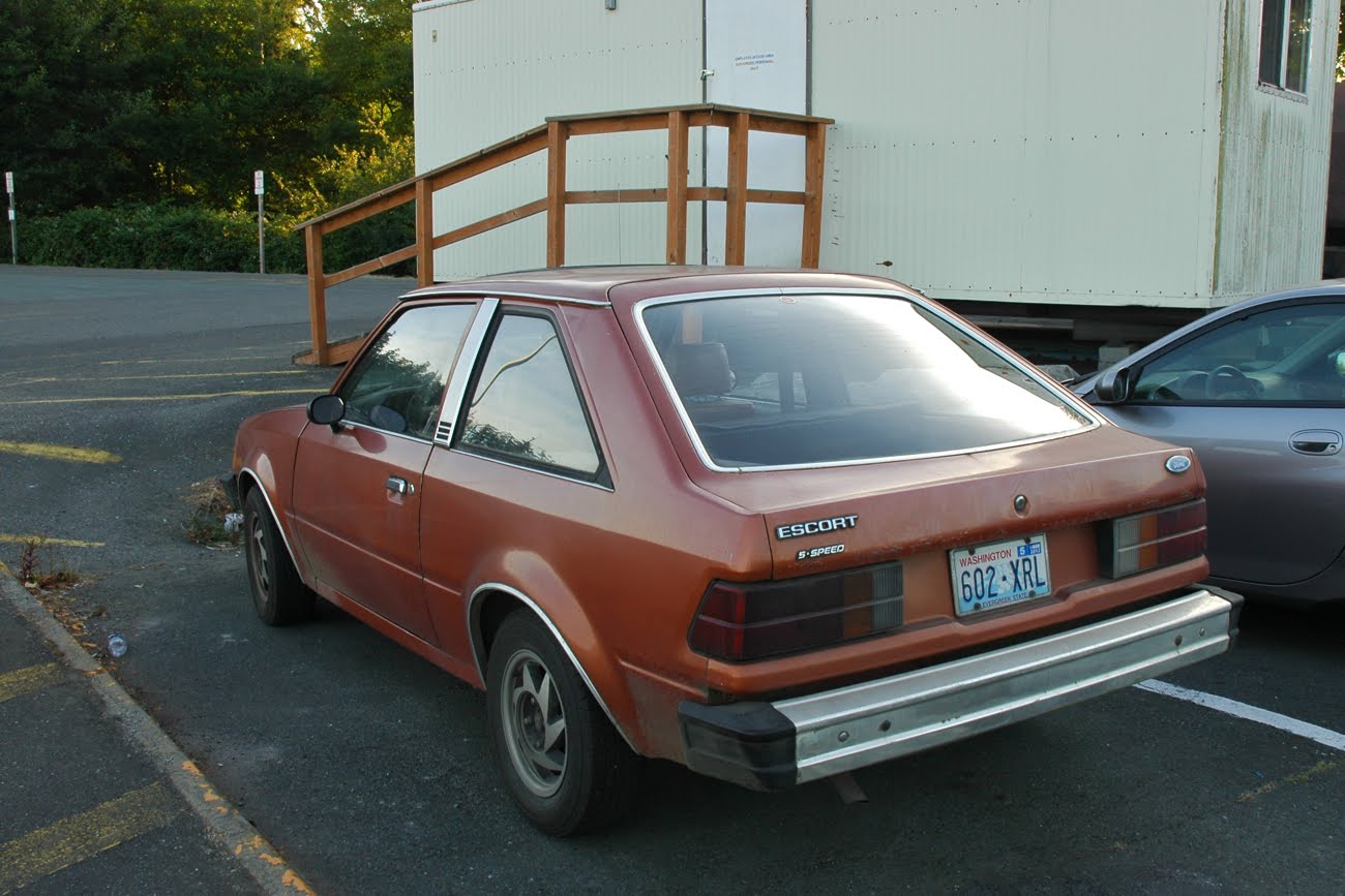 OLD PARKED CARS.: 1983 Ford Escort.