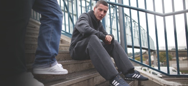 As you can see Devlin is seen wearing a hoodie, Adidas trainers and tracksu...