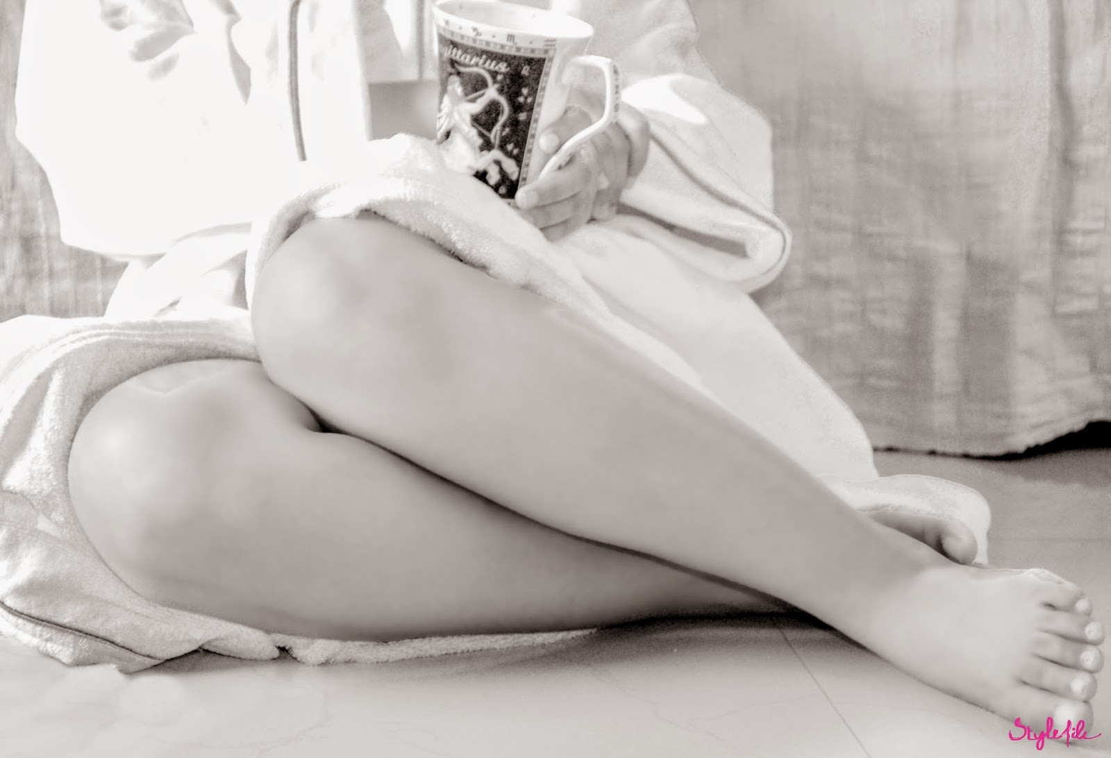 Dayle Pereira of Style File India shoots a series of black and white pictures of her legs while wearing a bathrobe and holding a mug