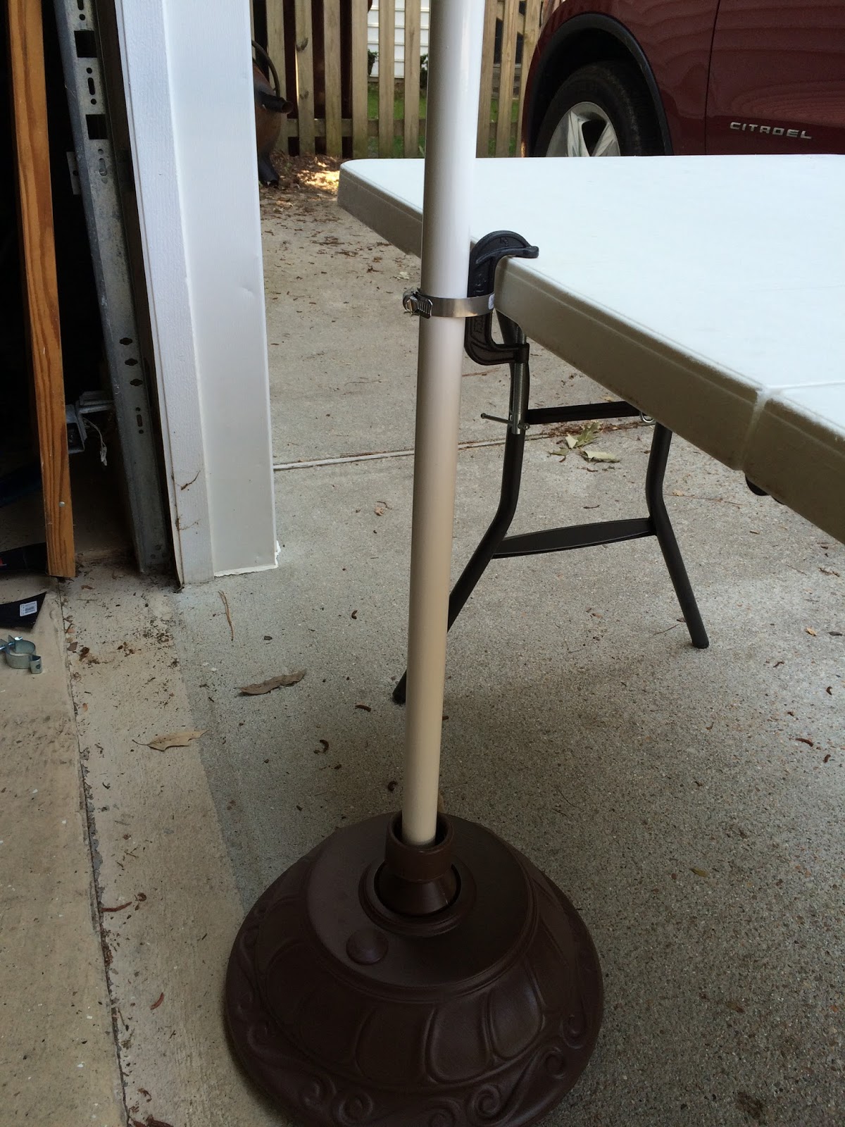 Securing a Market Umbrella at an Outdoor Craft Show