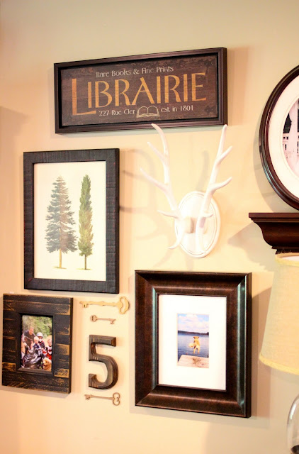 gallery wall with antlers and keys via www.goldenboysandme.com