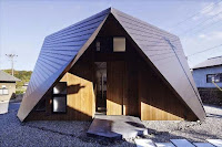 Origami House Design with A-Frame in an Old Village Surrounded by Mountains Origami House Design with A-Frame in an Old Village Surrounded by Mountains