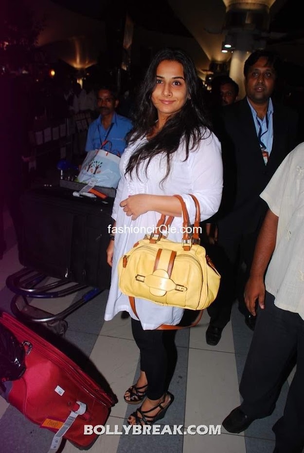 Vidya balan yellow purse - Vidya balan returning from IIFA 2012