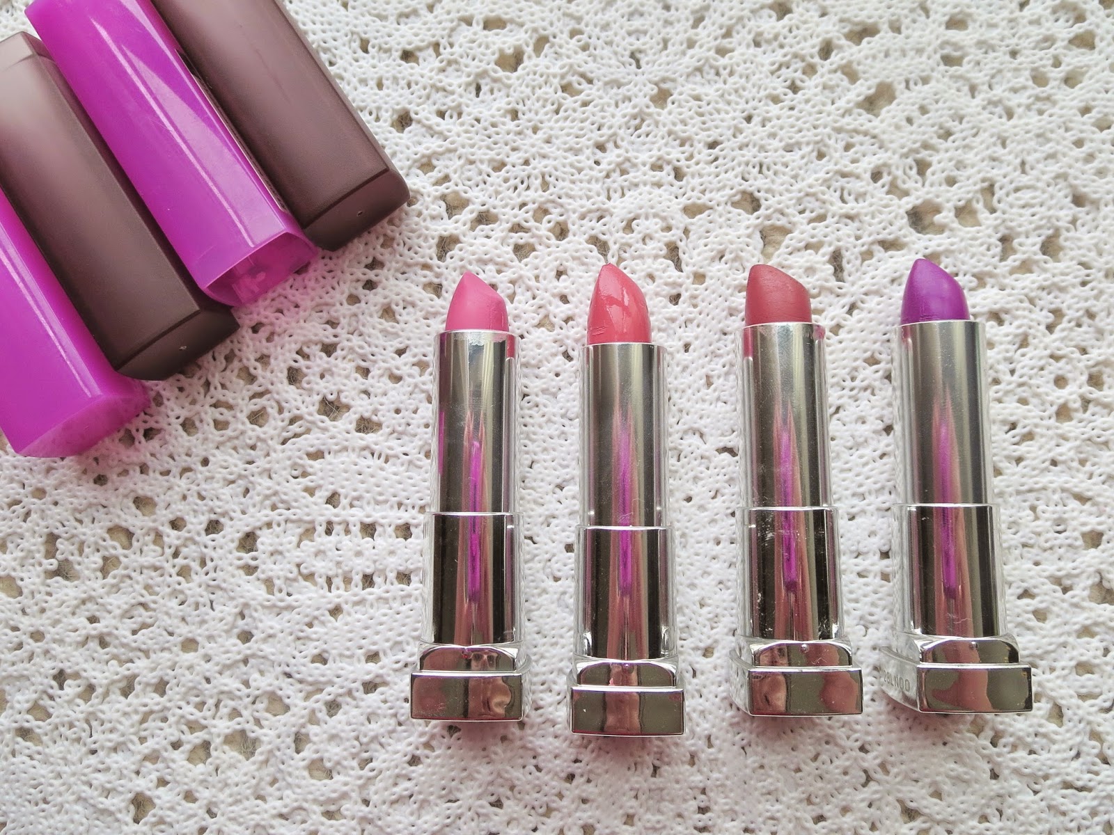 a picture of Maybelline lipsticks ; Ravishing Rose, Blushing Bud, Touch of Spice, Orchid Ecstasy