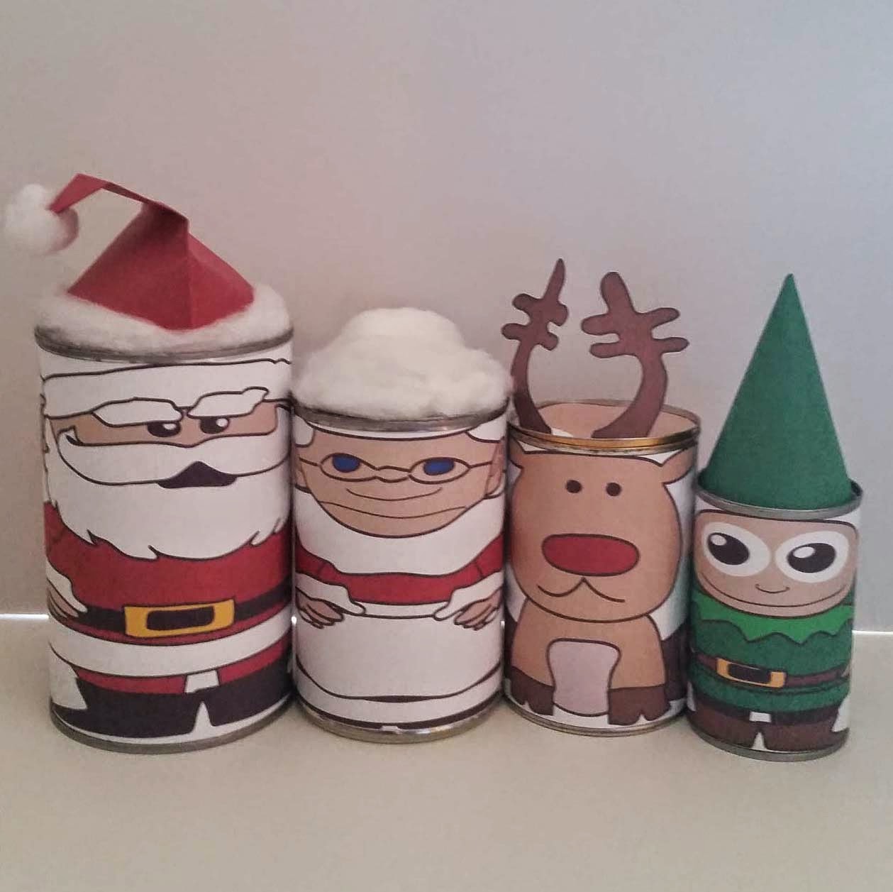 http://www.upcycleddesignlab.com/2014/12/upcycled-tin-can-christmas-nesting-dolls-free-printable.html
