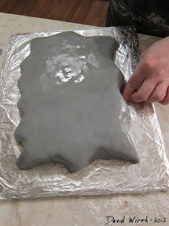 making a homemade fondant cake, purple frosting, smooth cake