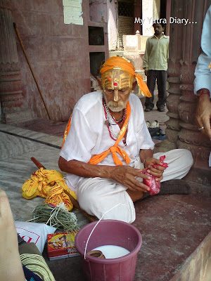 A priest with a tilak on forehead at the Yamuna River Ghat, Mathura